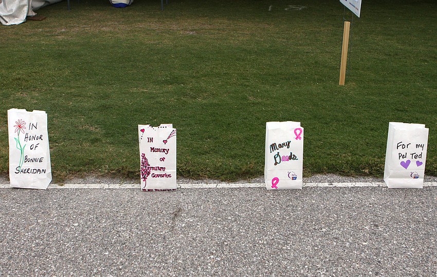 A grouping of luminaries line the track at Sarasota High School.