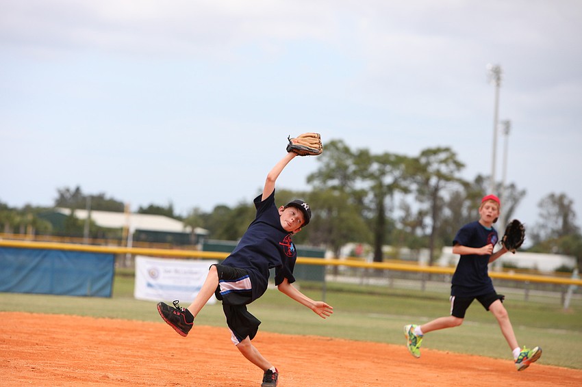 Eric Epp makes an impressive catch, Friday, May 4, during Ashton Elementaryâ€™s World Series Day at Twin Lakes.