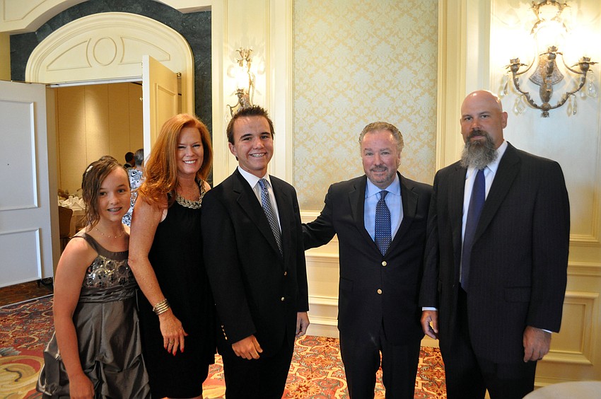 Mikayla, Terri, Max and Michael Klauber with coach Casey Galvanek