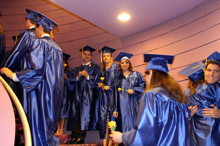 Students make their way up the stairs in order to line up alphabetically, Sunday, June 3, at the Van Wezel.