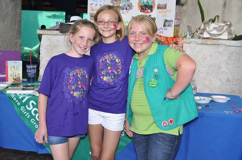 Girl Scouts Madelyn Brown, Maggie Cool and Briella Longhitano of Troop 803 Sarasota run a booth