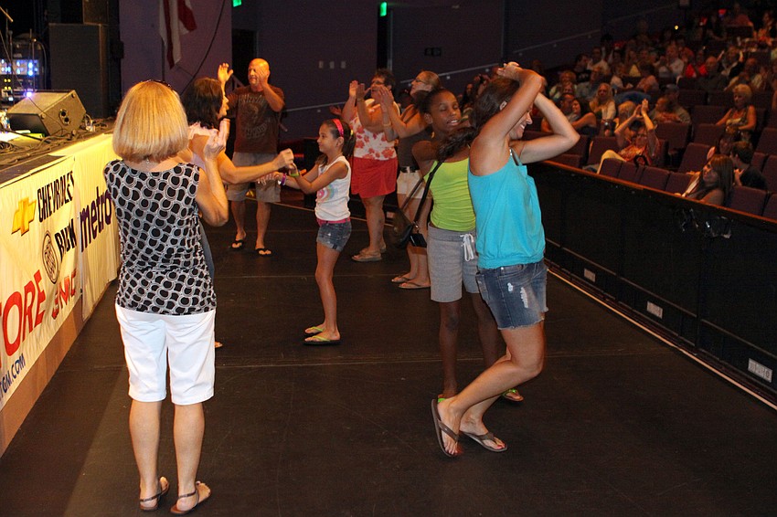 Many people made their way to the front of the stage to dance along to Adrian Ray.
