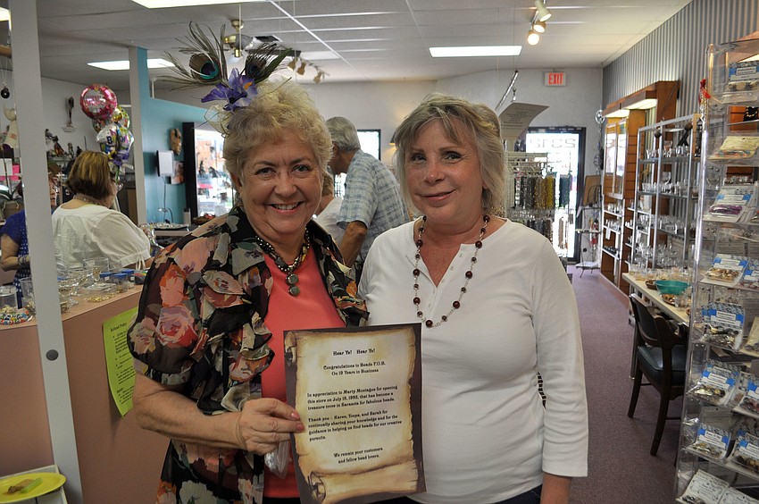 Regular customer Joyce Dunlop made Marty Montague a commemorative scroll.