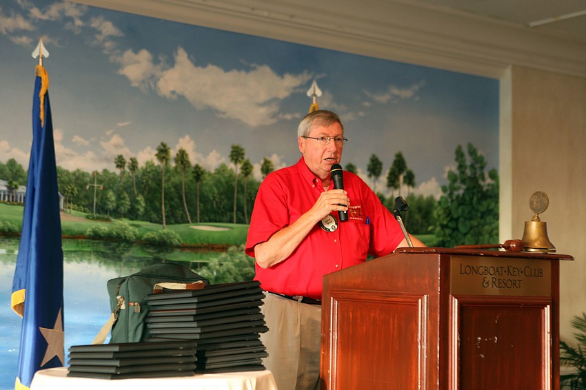 John Wild speaks to the crowd prior to the beginning of the Kiwanis Scholarship presentation, Thursday, August 16, at the Longboat Boat Key Club.