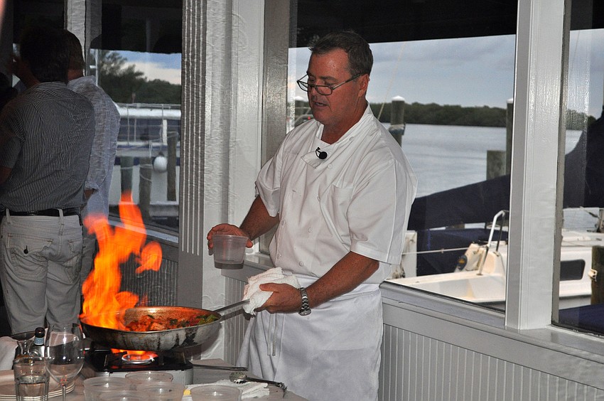 Tommy Klauber shows off his flambÃ©ing skills while leading the interactive dinner, Friday, Aug. 17, at Pattigeorgeâ€™s.