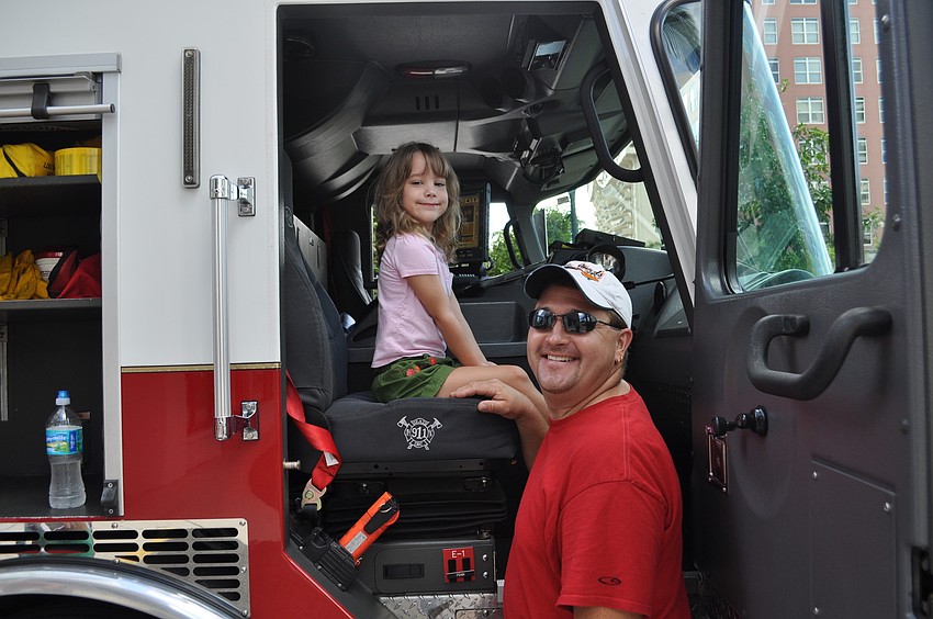 Miguel Fenix shows Alex and Spencer Schurawel how to use a thermal camera.