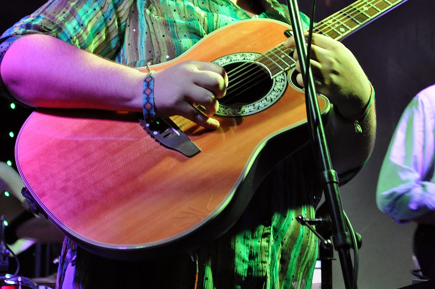 Using a lighter as a slide, Jake Elrod slides up to hit the high notes.