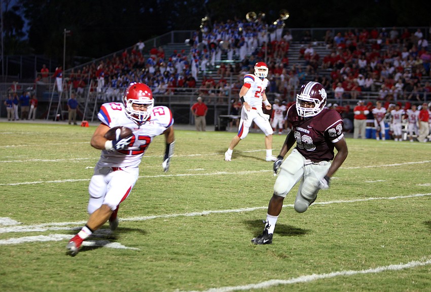 Anthony Lauro, No. 23, makes his way down the field with the ball as Peter Hubert, No. 23, tries to catch up to him.