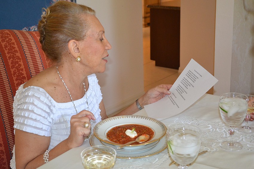 Hostess Myra Rakoff reading a celebratory poem written by her husband