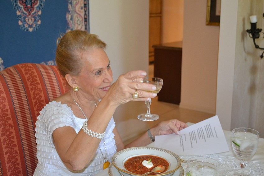 Hostess Myra Rakoff toasts the bride