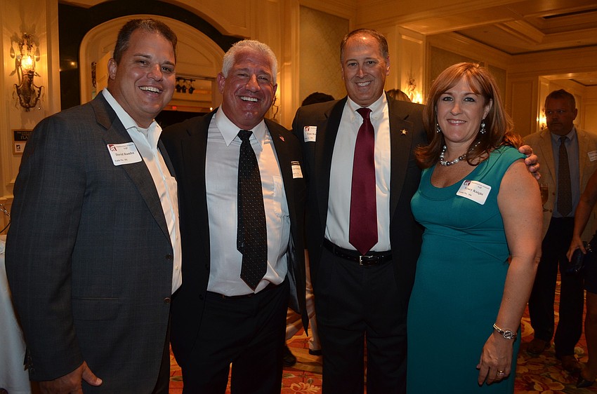 David Ramba and Gary Kompothecras with Sheriff Tom Knight and his wife, Tracy
