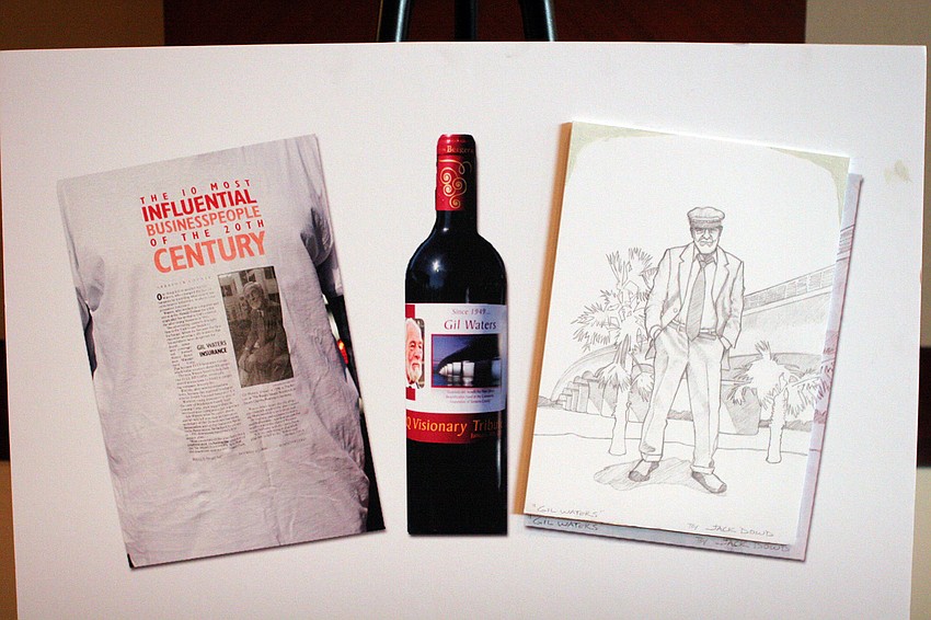 A poster board showing the commemorative gifts people could receive by donating including the SRQ Tribute T-Shirt, SRQ Tribute Commemorative Wine Bottle and the SRQ Tribute signed Jack Dowd print.