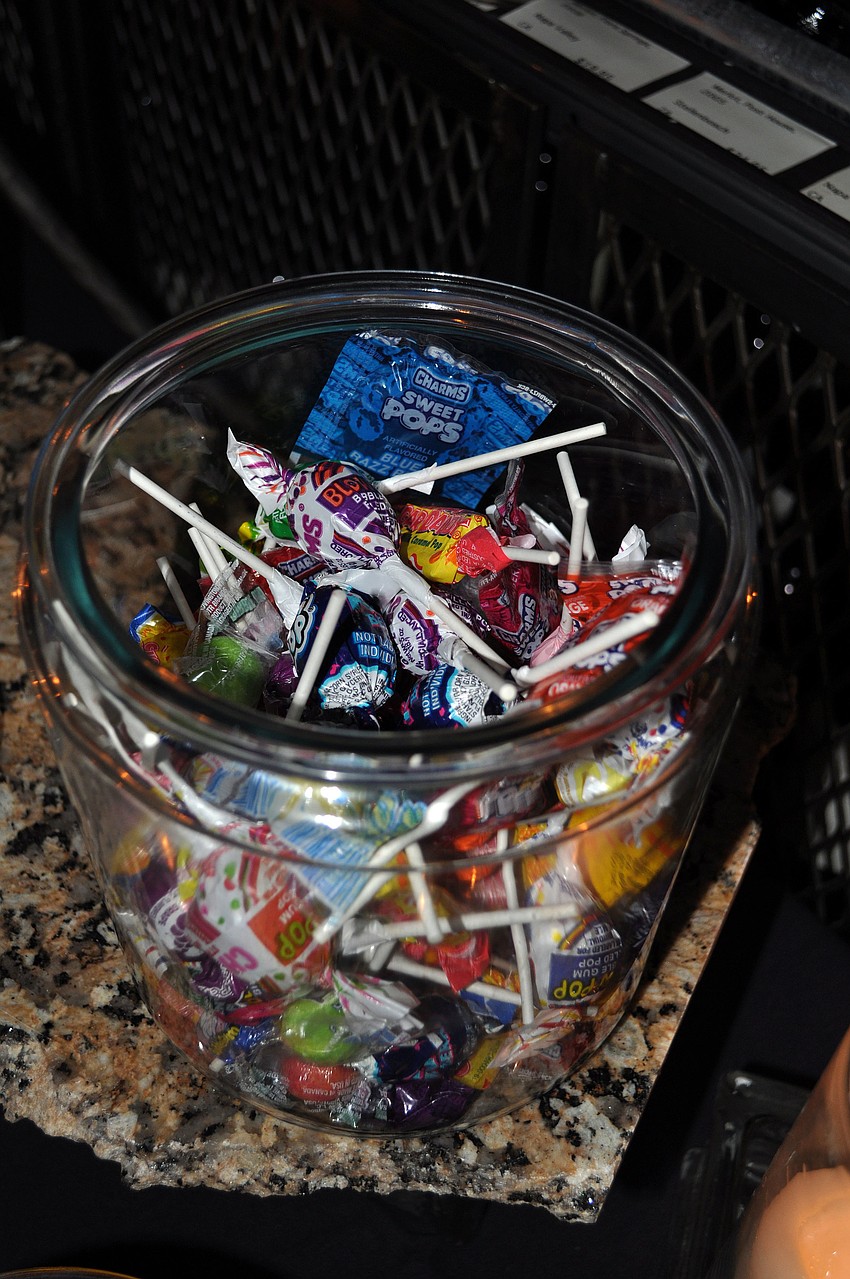 One of the many candy jars located on the dessert table.