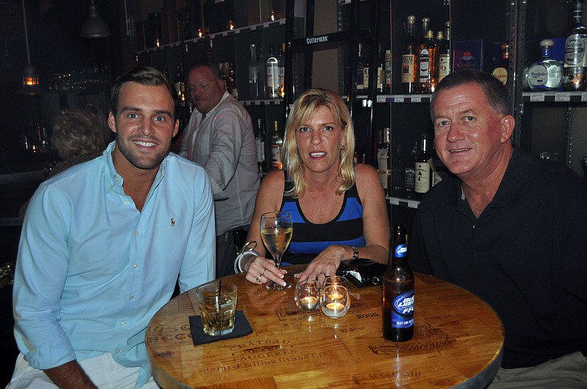 Robby Haynes sits with Cheryl and David McDuffee