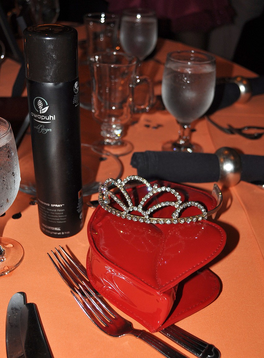 A red, lip-shaped clutch, a tiara and hairspray were set down at one of the tables at Southsideâ€™s Prom Night Saturday, Sept. 15 at Michaelâ€™s on East.