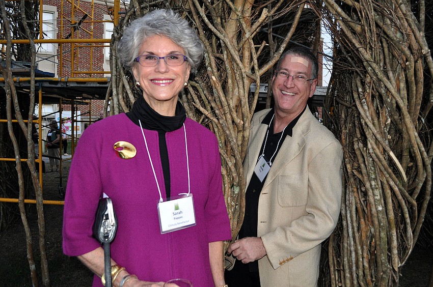 Sarah Pappas and Randy Finch have fun in the stick sculpture.