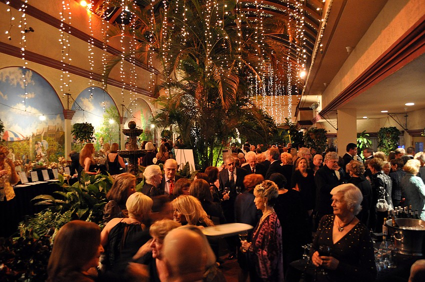People chat with one another Friday, Nov. 30, at Designing Women Boutique's 10th Anniversary Gala Winter Wonderland at Michael's on East.