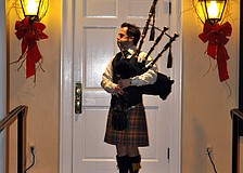 Ross Allen plays the bagpipe as guests arrived.