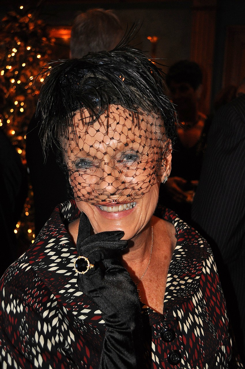 Sandy Drettmann models the Judith Ripka diamond and hematite ring that was being raffled off at the SPARCCle event Sunday, Dec. 2, at The Oaks.