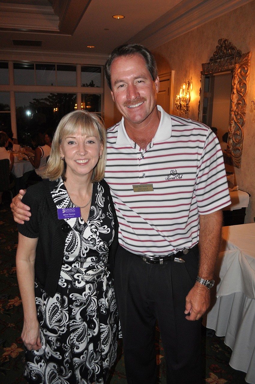 Olivia Thomas, director of SPARCC, with Matt Auen, director of golf at Laurel Oak Country Club