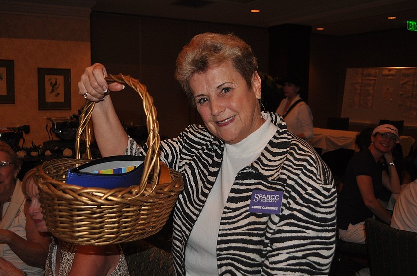 Jackie Clemmons sold 50/50 raffle tickets during dinner.