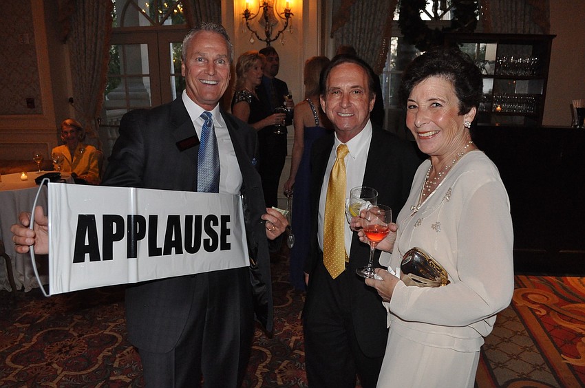 Magician Gary Roberts asks for applause from Armand and Jill Ross