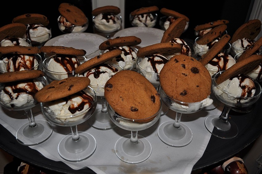 The dessert was vanilla ice cream covered in chocolate sauce with a giant chocolate chip cookie on top.