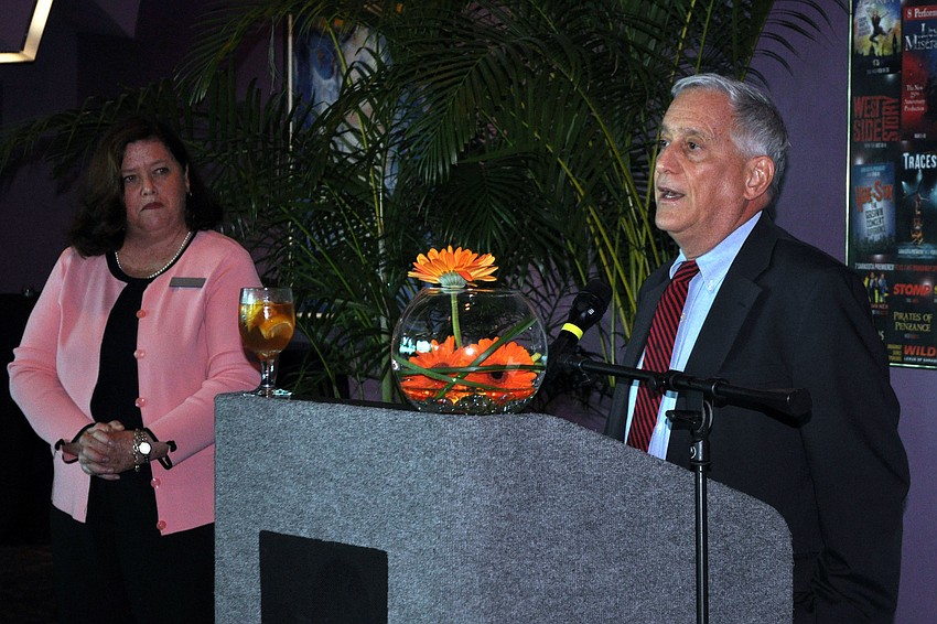 Stephanie Grosskreutz, chairwoman of the 2013 Town Hall Lecture Series, listens as guest speaker Walter Isaacson answers some questions at the luncheon.