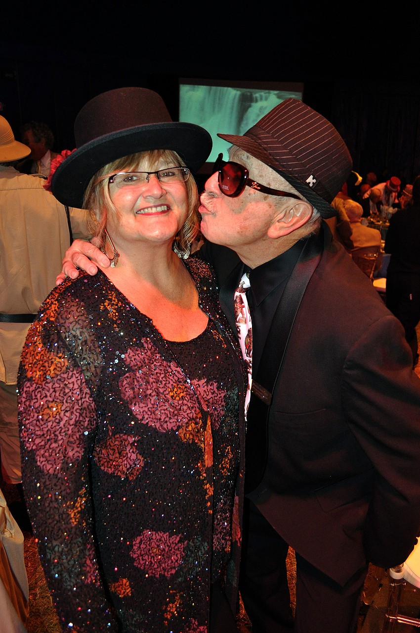 Tess Koncick gets a kiss on the cheek from Donald Malowsky