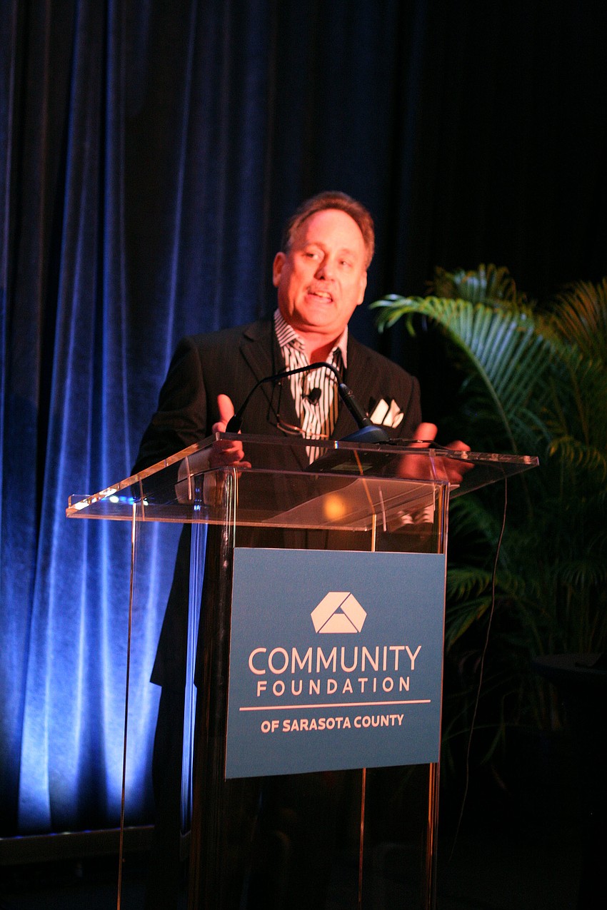 Chris Waters welcomes the crowd of more than 500 people.