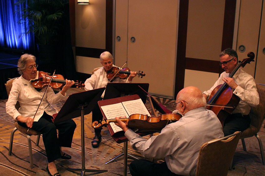 Mozartâ€™s Quartet in D Major (K. 575) performed by Estelle Holly, violin, Anita Brooker, violin, Paul Wolfe, viola, and Alfred Gratta, cello.