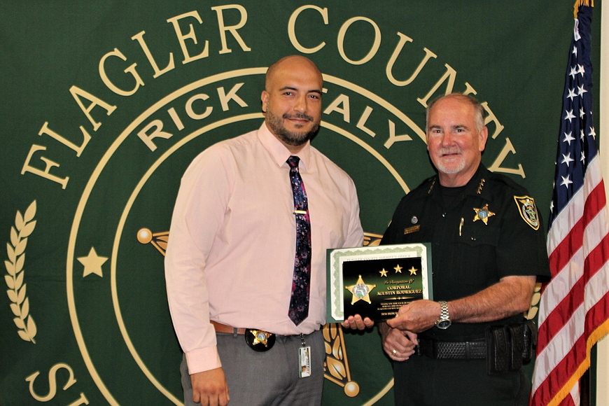 Cpl. Augustin Rodriguez, left,  receives the  Deputy of the Year award from Sheriff Rick Staly on July 22. Courtesy photo