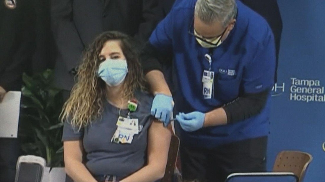 A health care worker gets vaccinated in December. News Service of Florida file photo