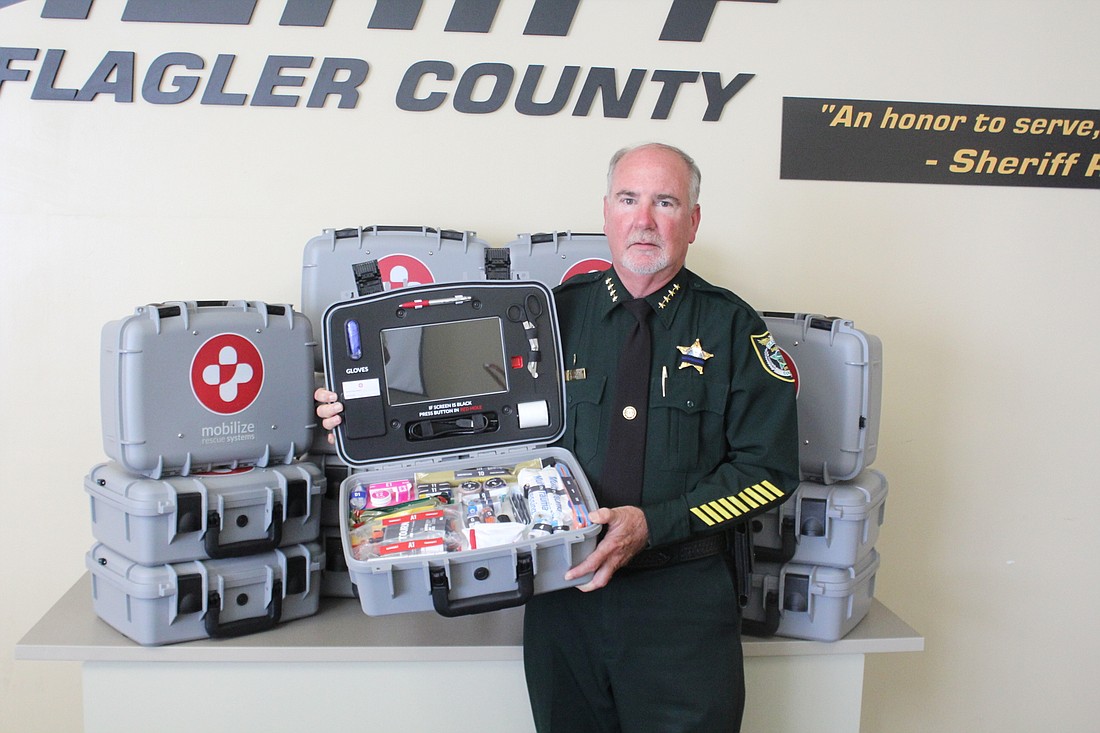 Sheriff Rick Staly is pictured with the 15 Mobilize Comprehensive Systems. Courtesy photo