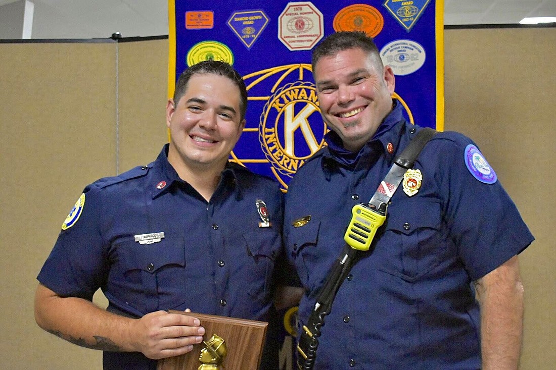 Palm Coast Fire Driver Engineer Joseph Fajardo is joined by Battalion Chief Gary Potter after being presented the 2021 Firefighter of the Year Award from the Flagler-Palm Coast Kiwanis Club. Courtesy photo