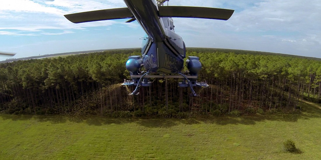 Flagler Mosquito Control helicopter. Photo from https://www.flaglermosquito.com/