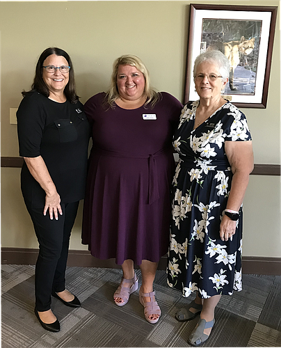 AAUW Flagler Co-Presidents Patti Paukovich (left) and Marty Butler (right) flank Candice Wilkie, Outreach Coordinator for the Family Life Center. Courtesy photo