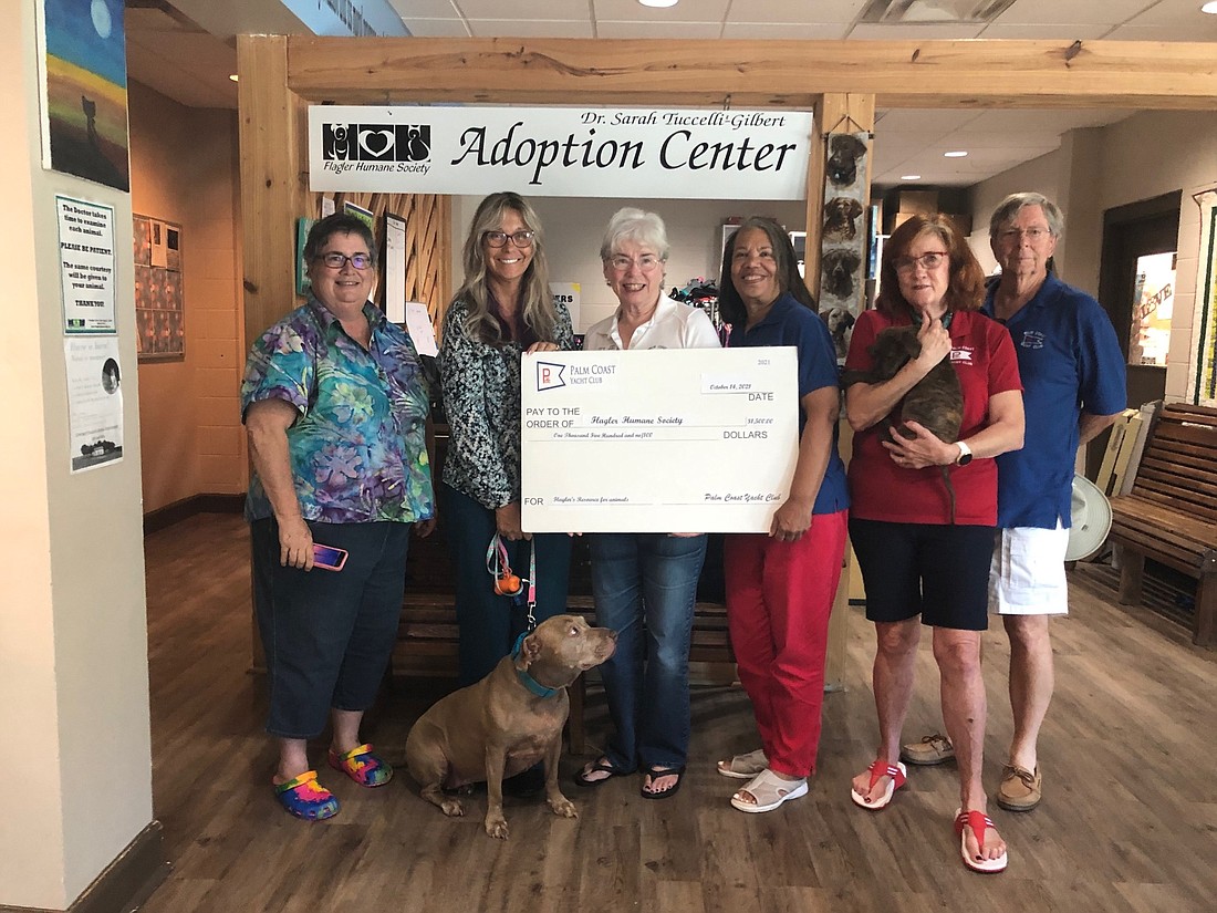 Lynn Meyers and Amy Wade-Carotenuto of the Flagler Humane Society, Yacht Club Rear Commodore Candayce Schmidt, Yacht Club member Ruth Anne Ferreira, and Andy Boothe, Yacht Club Treasurer.  Courtesy photo