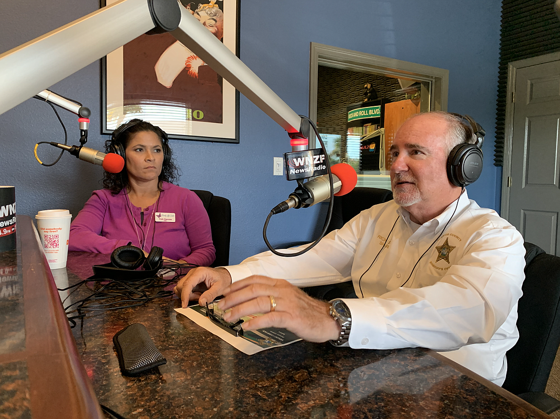 Family Life Center CEO Trish Giaccone and Flagler County Sheriff Rick Staly on the air Oct. 22. Photo by Brian McMillan
