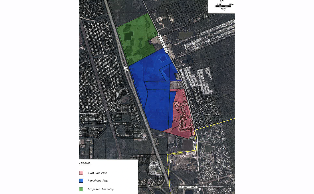 The existing Eagle Lakes subdivision is in red. The developer hopes to expand to the blue and green parcels to the north. Image courtesy of the Flagler County government