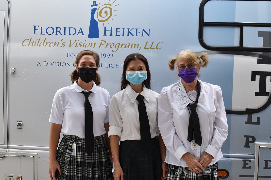 Flagler Health Department's School Health team traded their nursing scrubs for 'school uniforms' this past Halloween and posed in front of the Florida Heiken van: Allison Brown, Stephanie Ear and Luci Griggs. Courtesy photo
