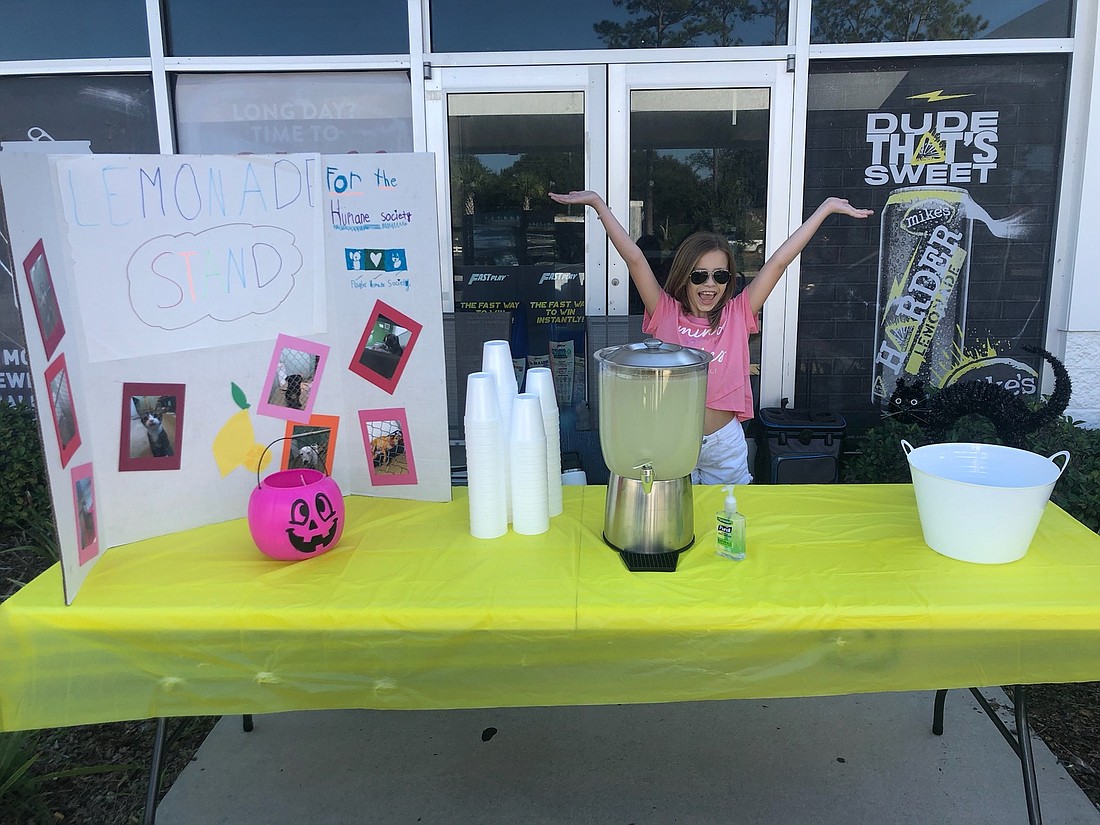 Victoria Greeney and her lemonade stand. Courtesy photo