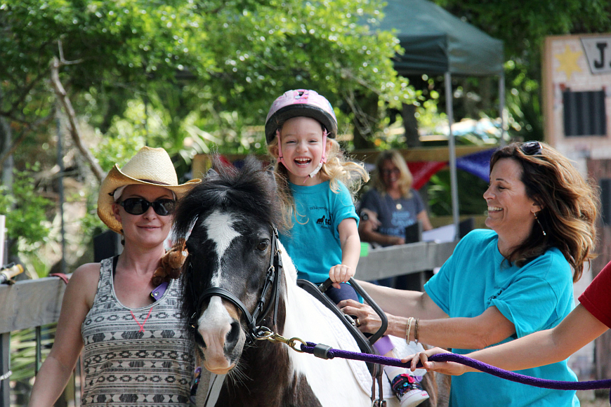 Avery Bishop, 4, finished her sequence with a trot at the Whispering Meadows Horse Show. File photo
