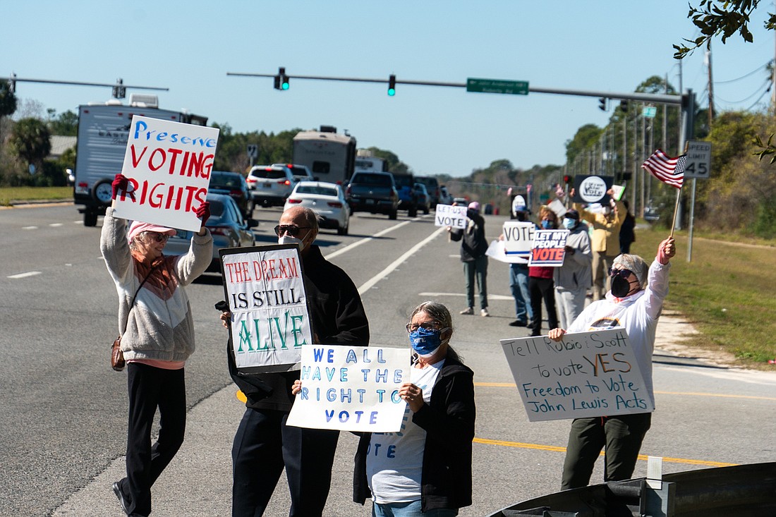 The Flagler Beach Democratic Club organized a rally on Martin Luther King Day, near Wadsworth Park. Courtesy photo by Stavros Panopoulous