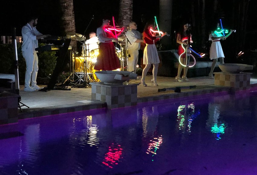 Violectric string rock band outdoor concert April 22 Observer Local