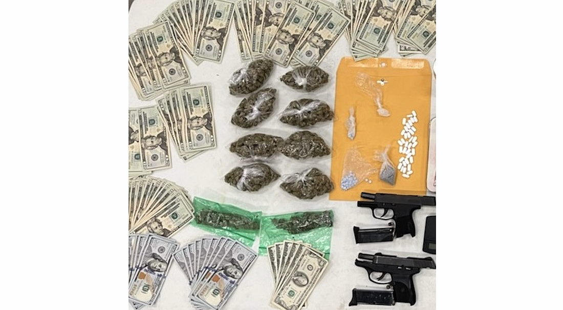 Some of the drugs, guns and cash seized from the suspect. Photo courtesy of the FCSO