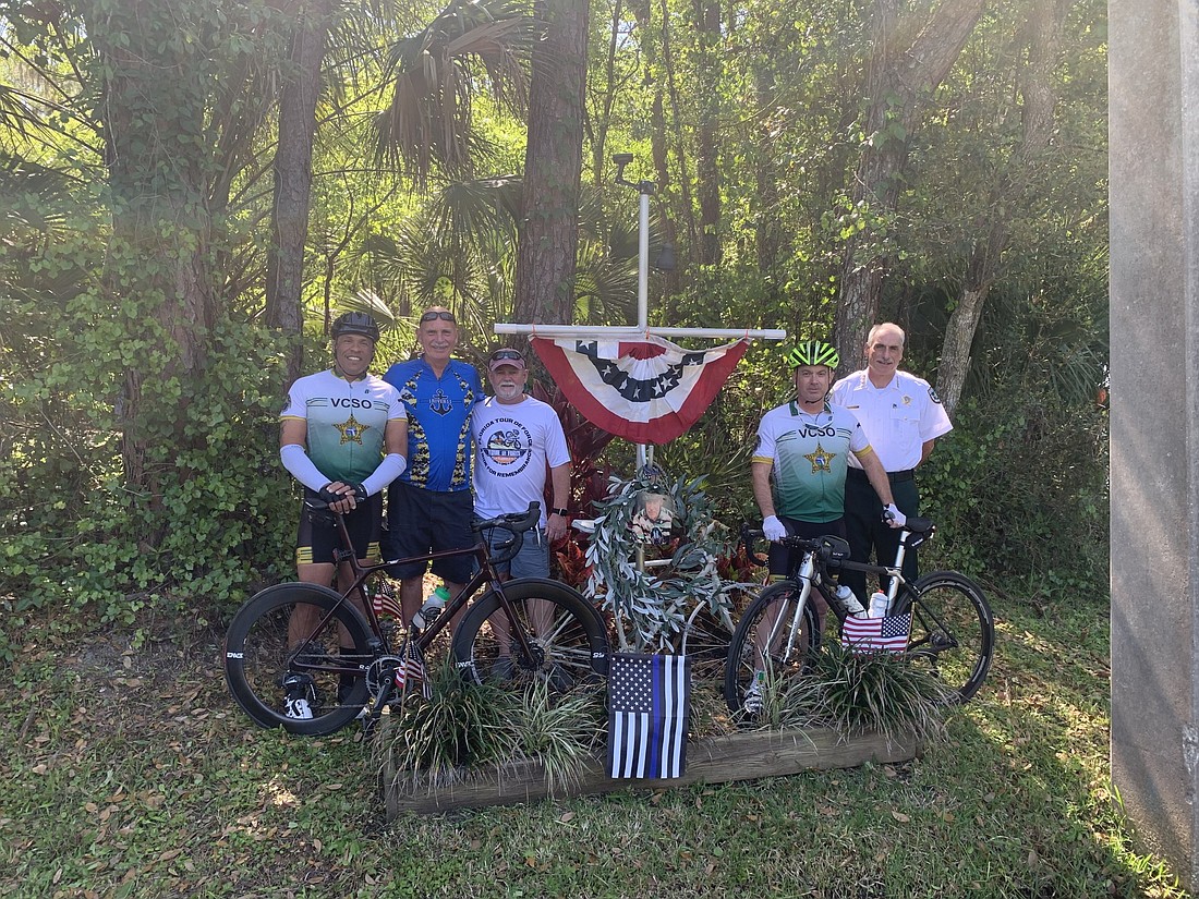 VSO Division Chief Tim Morgan, retired Daytona Beach police officer James Grover, Deputy Mark Willets, Deputy Mark Mathieson and Sheriff Chitwood at Frank Scofield's recent roadside memorial. Courtesy photo
