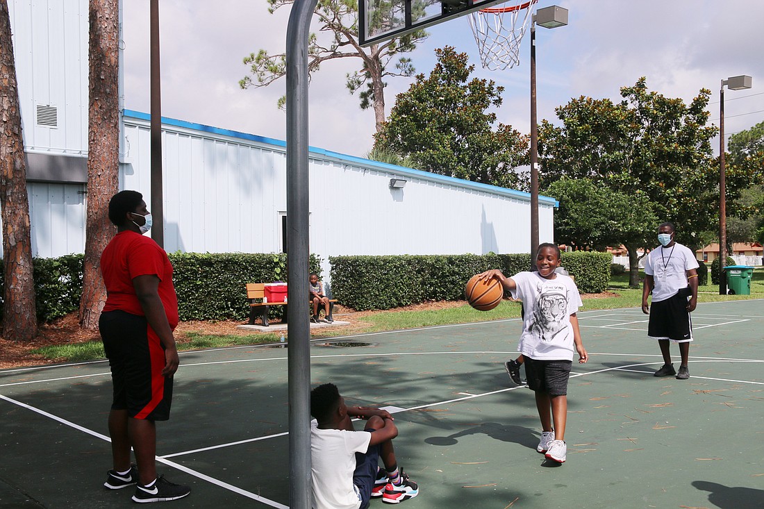 Boys play basketball during a 2020 summer camp at SONC. The court has since been removed for the new gymnasium. File photo by Jarleene Almenas