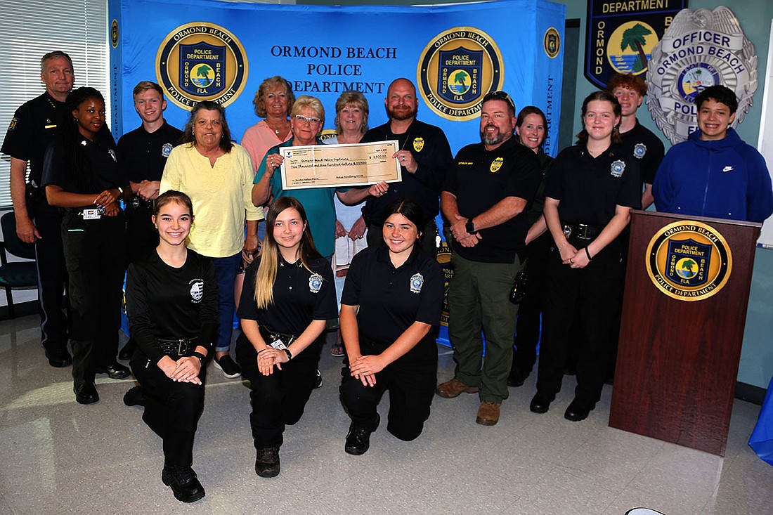 President Linda Pippin and officers of The Fraternal Order of Eagles #4435 Ormond-by-the-Sea Ladies Auxiliary present a donation of $2,500.00 to the Ormond Beach Police Explorers Program. Courtesy of the city of Ormond Beach