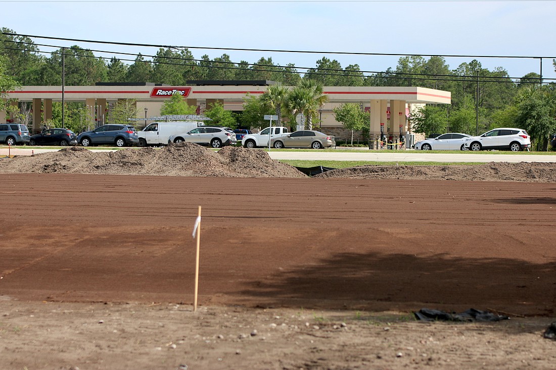 Site work has begun on the future Palm Coast Station, fronting State Road 100. The buidling will eventually house a Tijuana Flats, a Jeremiah's Italian Ice and Affordable Dentures. Photo by Brent Woronoff